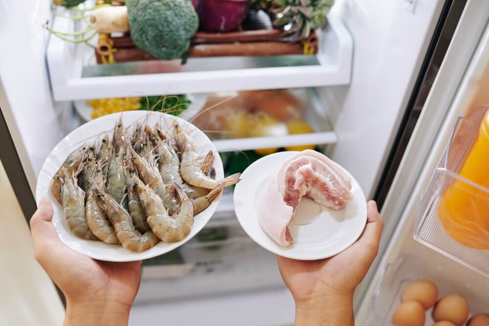 separating raw meat from other ingredients in refrigerator