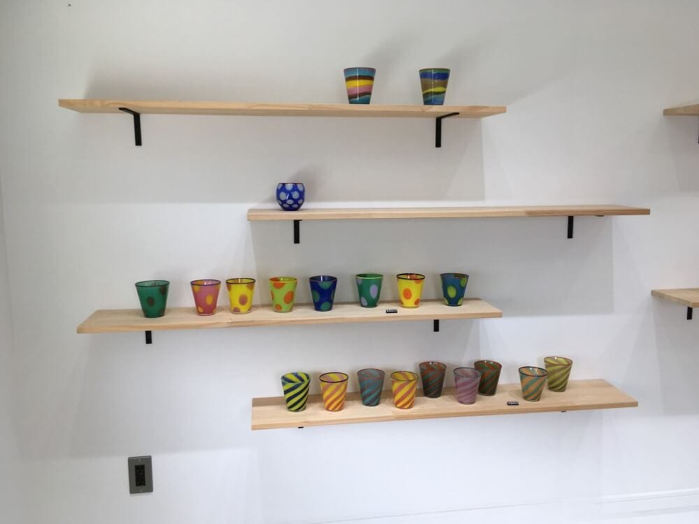wooden hanging shelves used for decorating decorative glasses