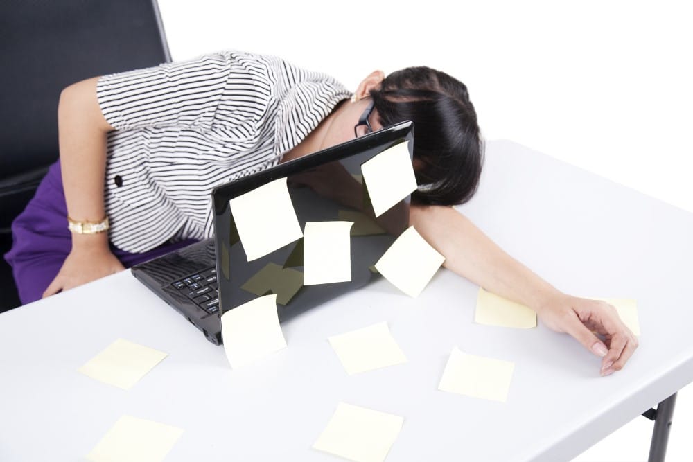 businesswoman sleeping on desk