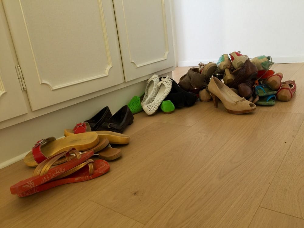 pile of shoes inside the bedroom