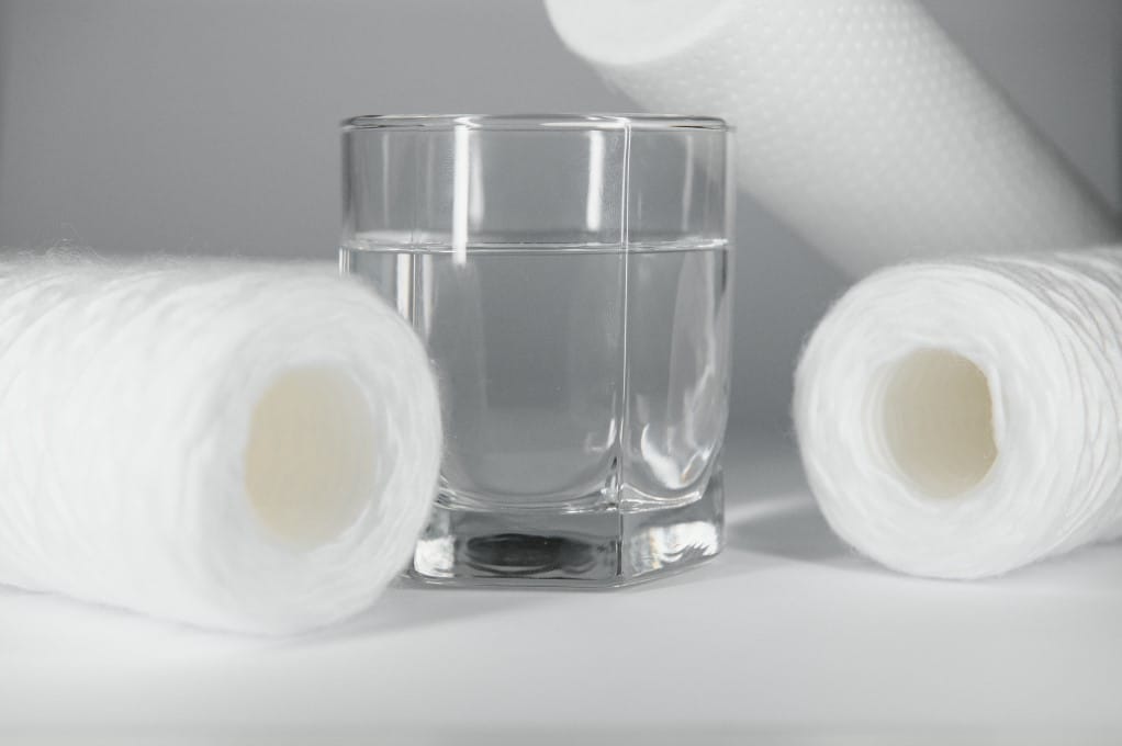 paper towel and a glass of water