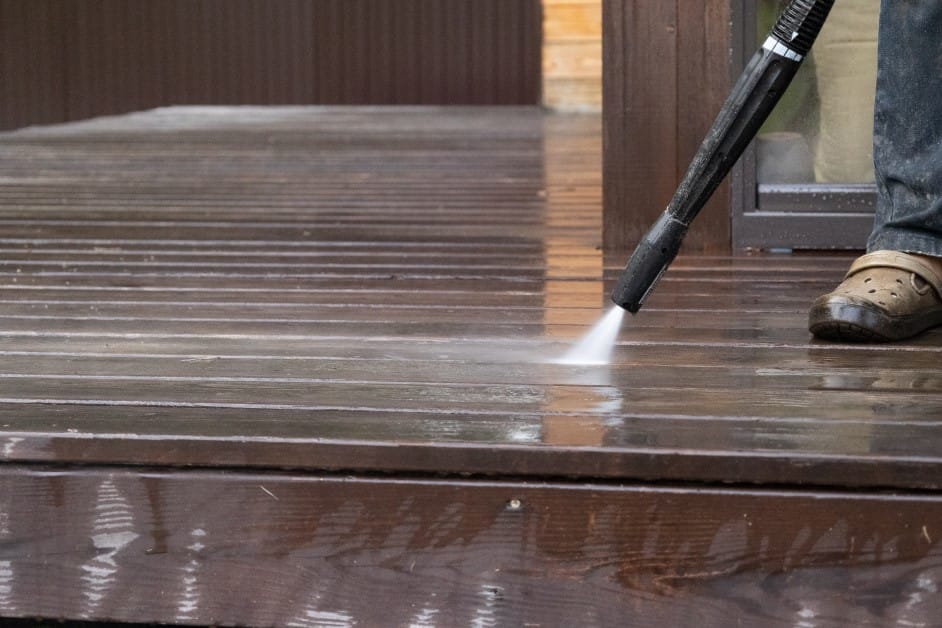 cleaning wooden floor with pressure washer