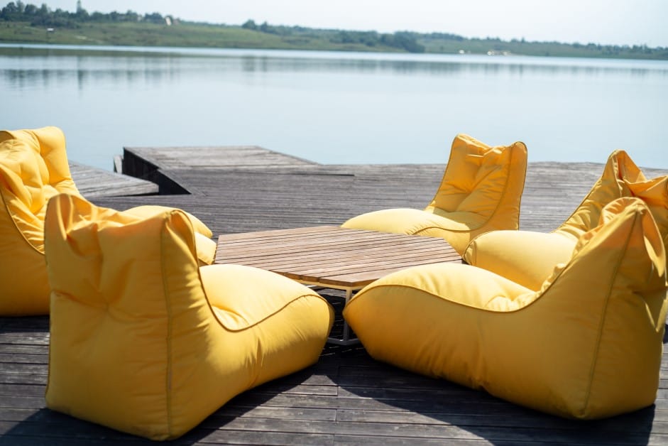 Yellow Outdoor Cushions and Fabrics in Front of a Lake