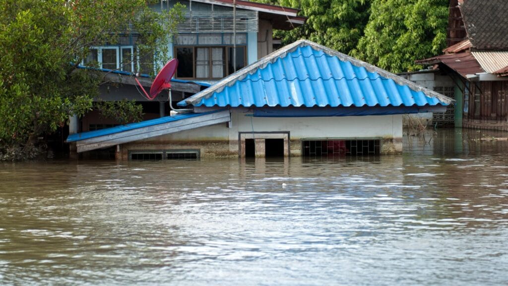 Residential houses partially submerged in floodwater