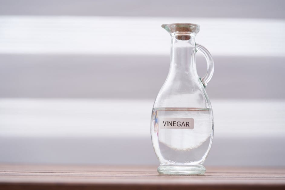 white vinegar cleaner on table top