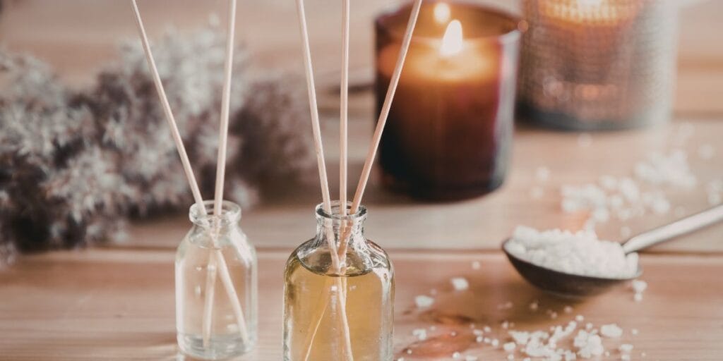 A luxury scented candle and reed diffuser set in elegant packaging for home fragrance.