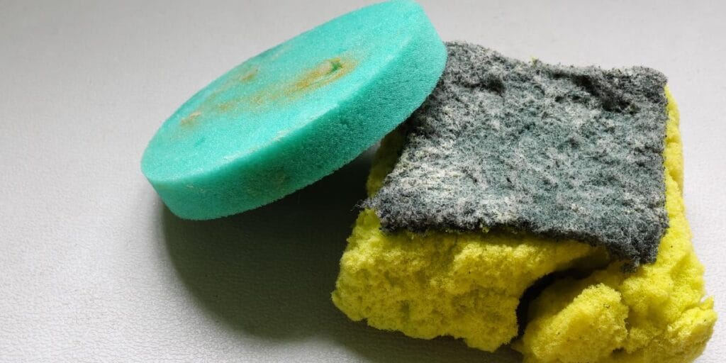 Old worn out kitchen sponges to throw out during a January home deep clean